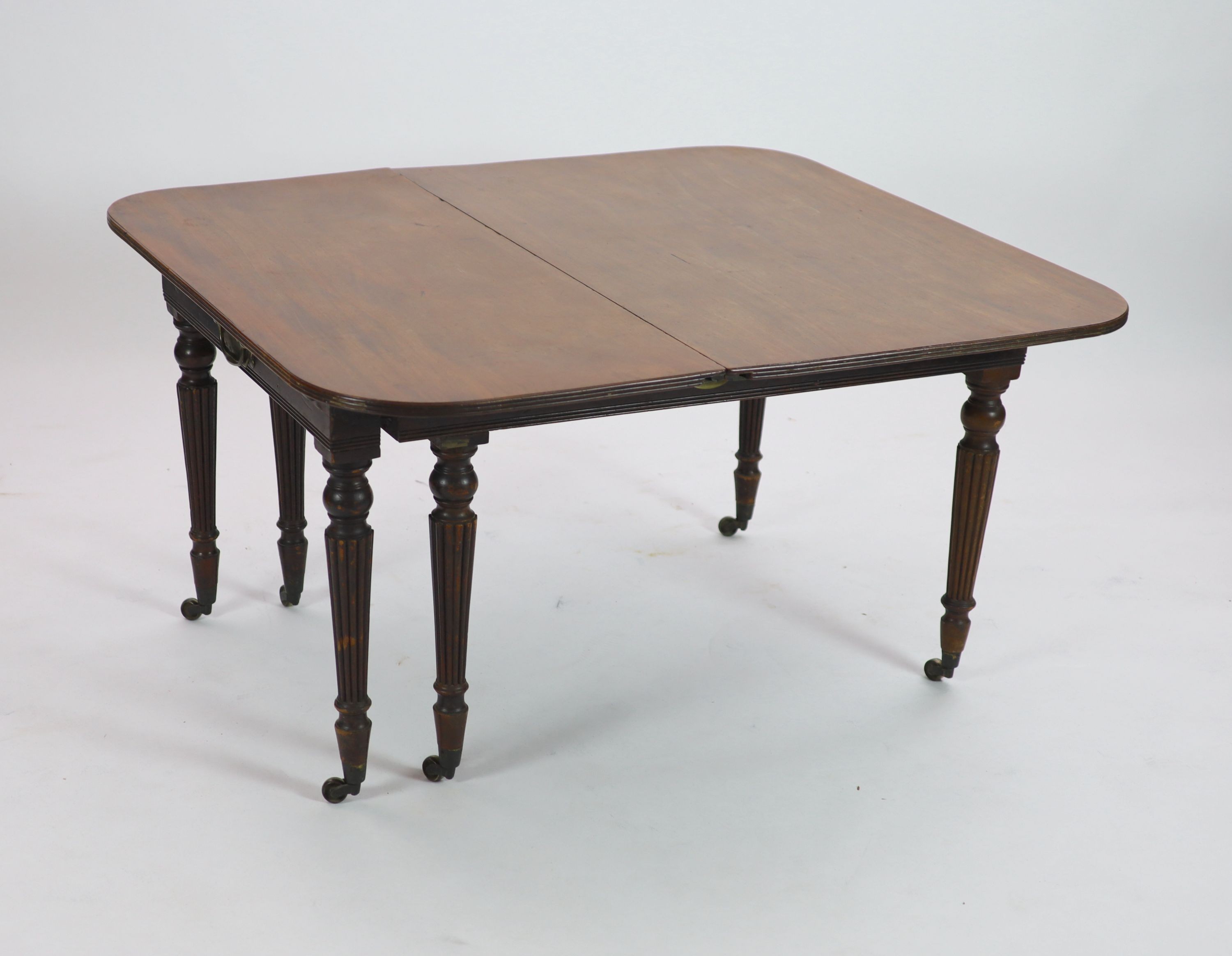A Regency Morgan & Sanders Patent 'Imperial' mahogany extending dining table, W.137cm D.122cm Extends to 211cm H.72cm